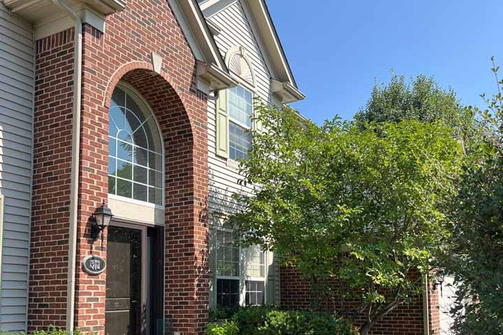 Roof with a ladder leaning on it.
