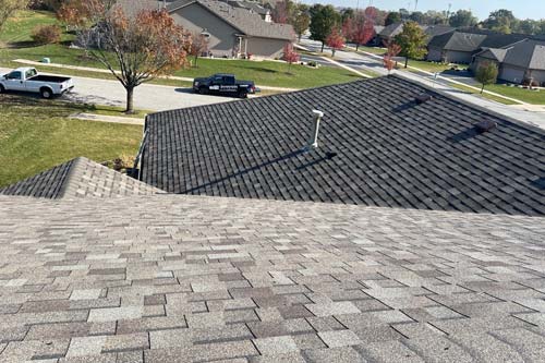 Front view of house with red white blue flag on porch.