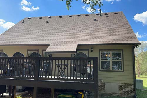 View of house with a back patio.