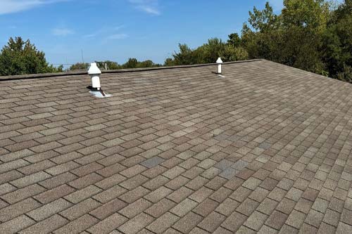 Arial view of house with red shingle.