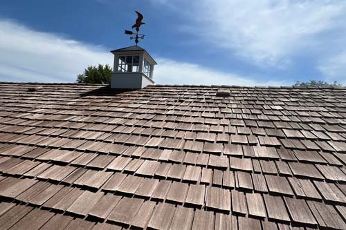 Cluse up of roof install. Custom shingle.