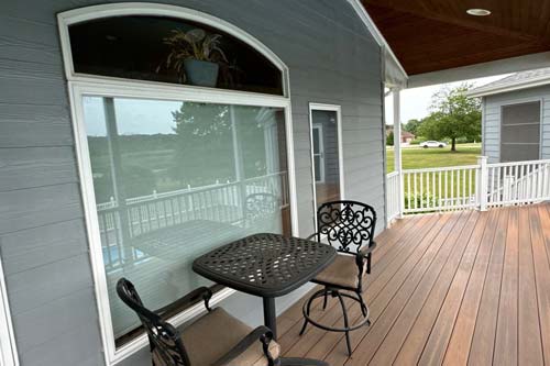 Closeup of a window looking over the porch